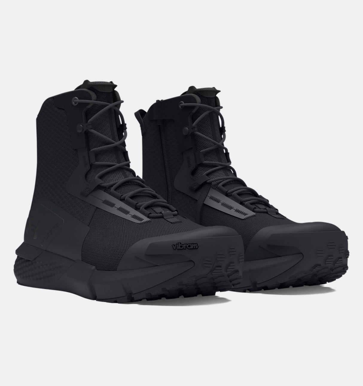 Black tactical boots on a light gray background