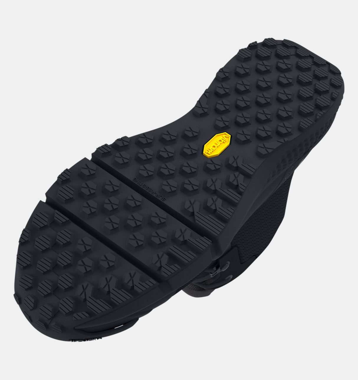 Close-up of a black shoe sole with a yellow logo on a light gray background