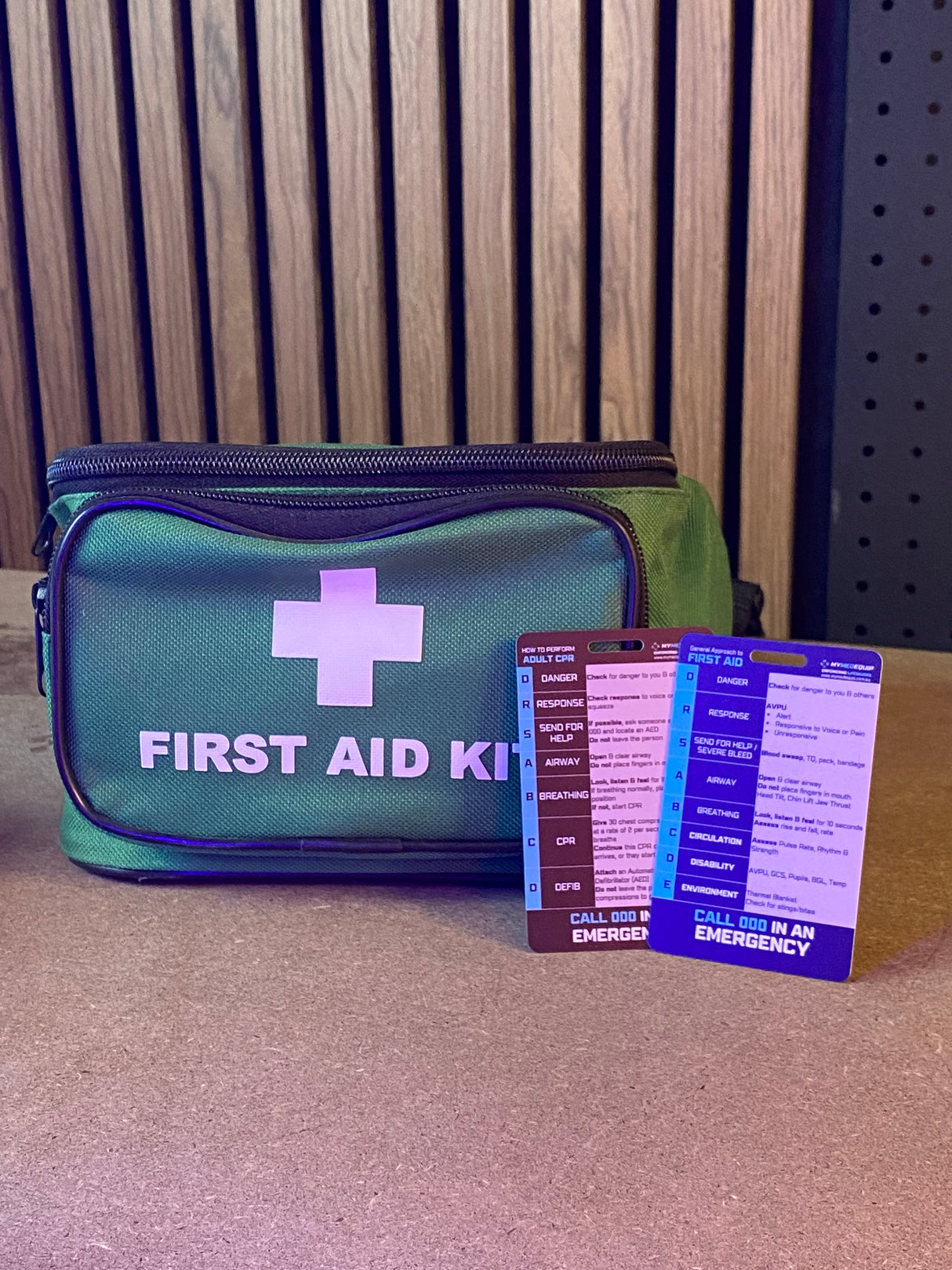 Reverse of MyMedEquip first aid wallet card with CPR and first aid steps
