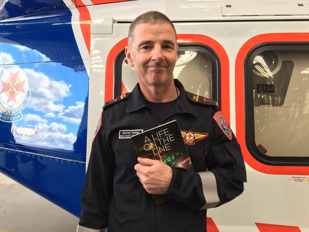 Darren_Hodge_Life_on_the_Line_MICA_HEMS_Helicopter_in_background