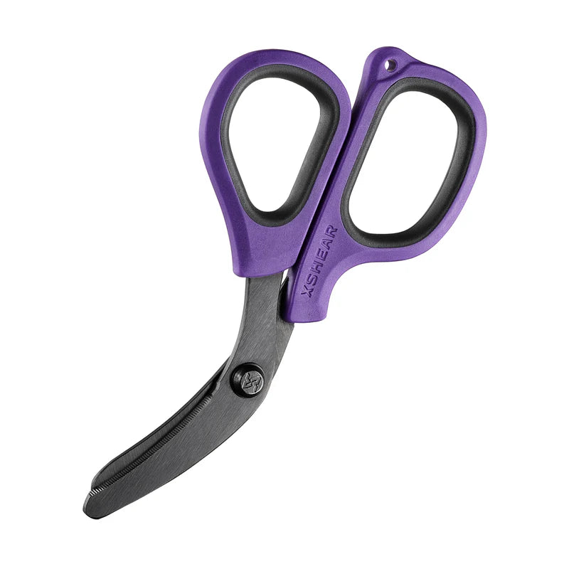 A pair of XShear Mini Trauma Shears with purple handles and curved blades.