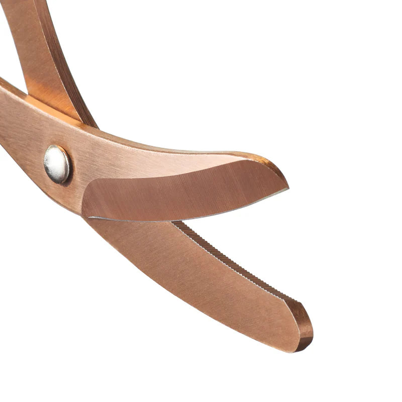 A pair of rose gold coated heavy duty trauma shear blades