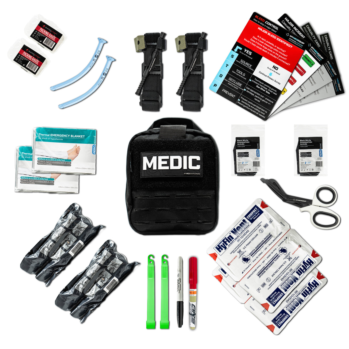 Black Tactical Medic Kit on white background with trauma and medical supplies including nasopharyngeal airways, packing gauze, ARS decompression needle, DNIPRO Tourniquet, chest seals, emergency bandages, medical guidelines and other medical supplies surrounding it.