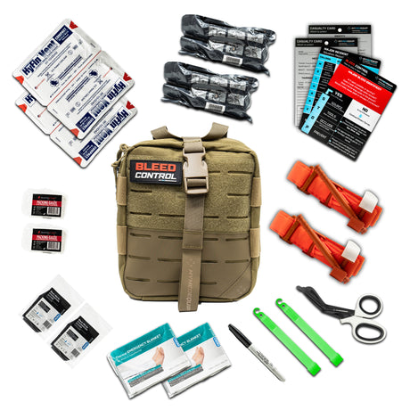 A Coyote Tan Coloured large IFAK (Individual First Aid Kit) with a red and white patch saying Bleed Control. Around the IFAK are laid out it's contents which include, gloves, a two combat a pplication Tourniquets, trauma shears, glow stick, sharpie marker pen, Bleed Control Instructional Card, a casualty card, two chest seals a thermal blanket and two 4" trauma pressure bandages.