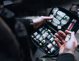 Medic accessing NARCO Pouch with vials and injection equipment inside