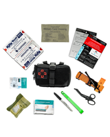 TraumaFix IFAK contents laid out including field dressing and packing gauze