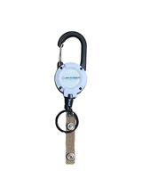 Carabiner badge reel clipped to nurse uniform with metal cable extended