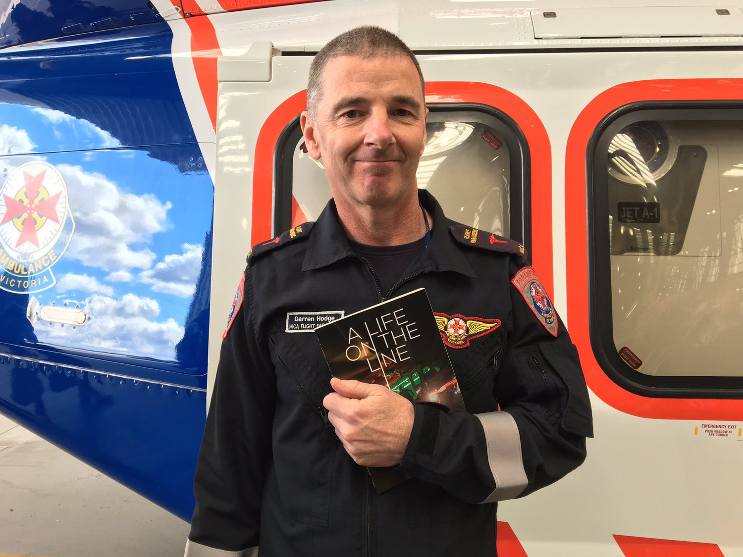 Darren_Hodge_Life_on_the_Line_MICA_HEMS_Helicopter_in_background