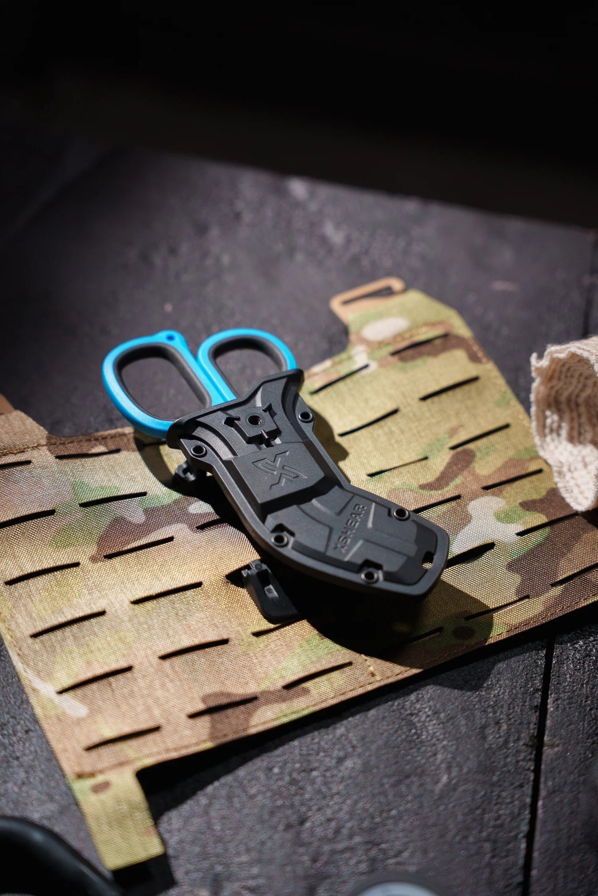 XShear holster mounted on MOLLE webbing with 6" trauma shears seated