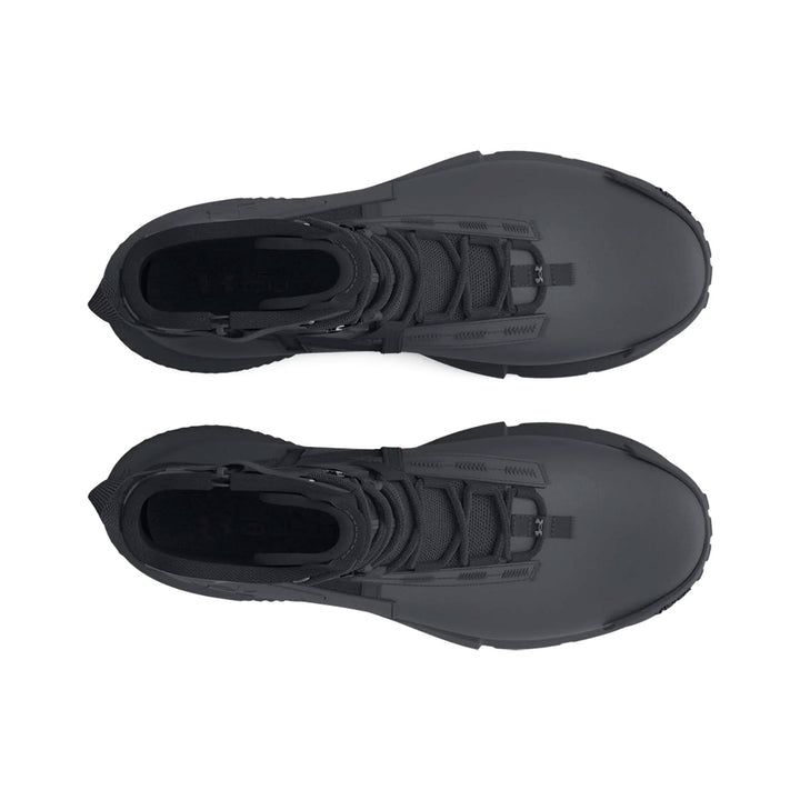 Pair of black high-top Under Armour sneakers on a white background