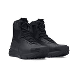 Pair of black tactical boots on a white background