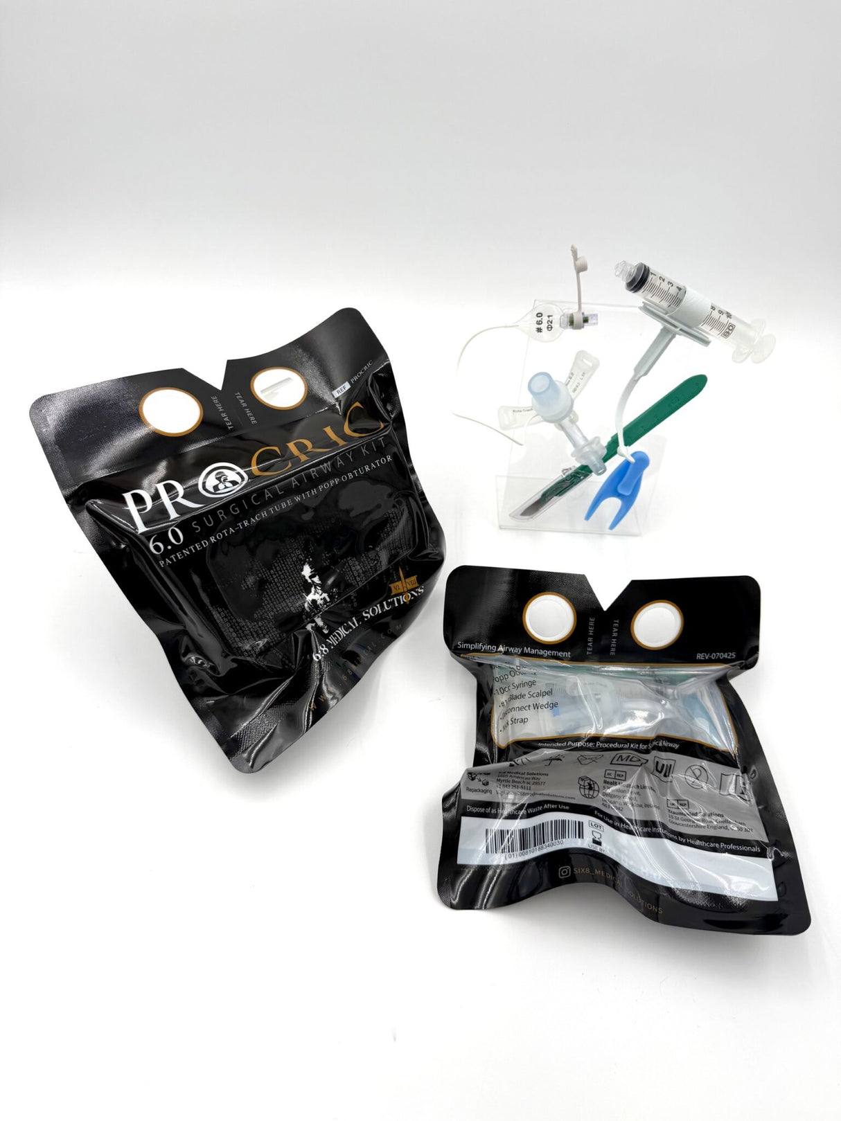 ProCric cricothyrotomy kit contents laid out - Rota-Trach tube, Popp Obturator, scalpel