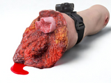 Tourn-IQ trainer leg with tourniquet applied above simulated bleeding wound