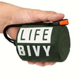 Bright orange Bivouac emergency survival bag packed in green drawstring pouch